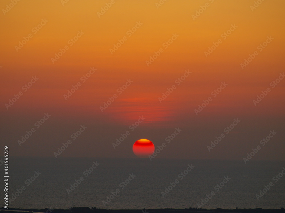 sunset like a salted egg yolk over the sea sunset like a salted egg yolk over the sea