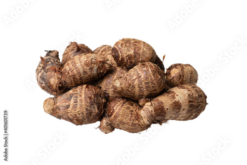 A heap of raw organic brown taro roots isolated on white background. Close-up and macro. 