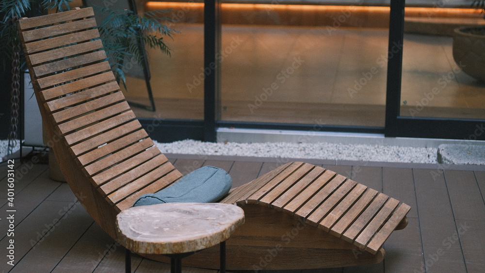natural wooden deck chair with side table