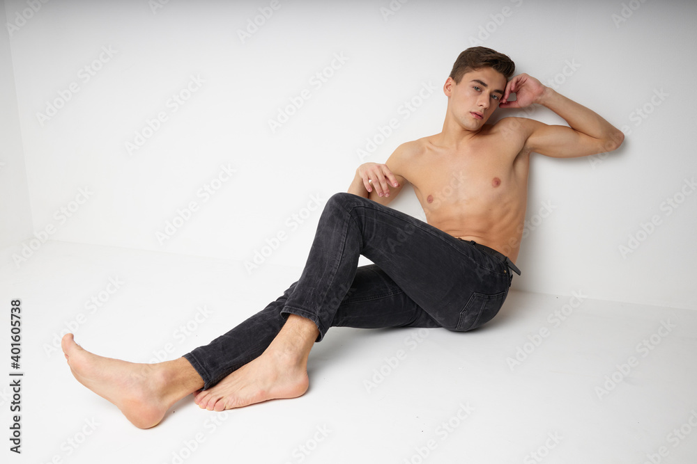handsome man naked torso black pants isolated background luxury