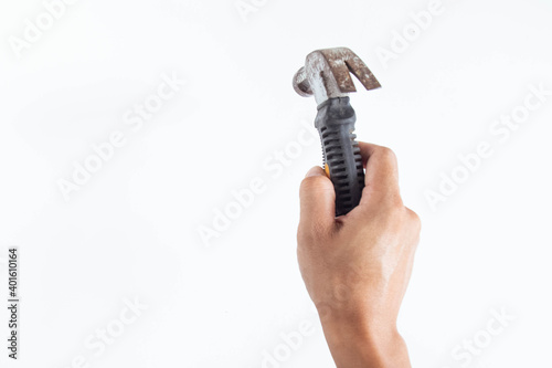 Top angle of young man right handed using hammer on white background