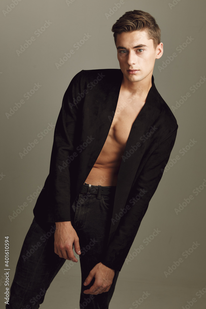 Fototapeta premium Man in black shirt posing portrait fashion modern hairstyle