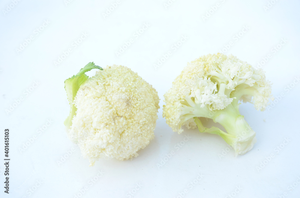 the fresh white cauliflower cut isolated on white background. the fresh white cauliflower cut isolated on white background.