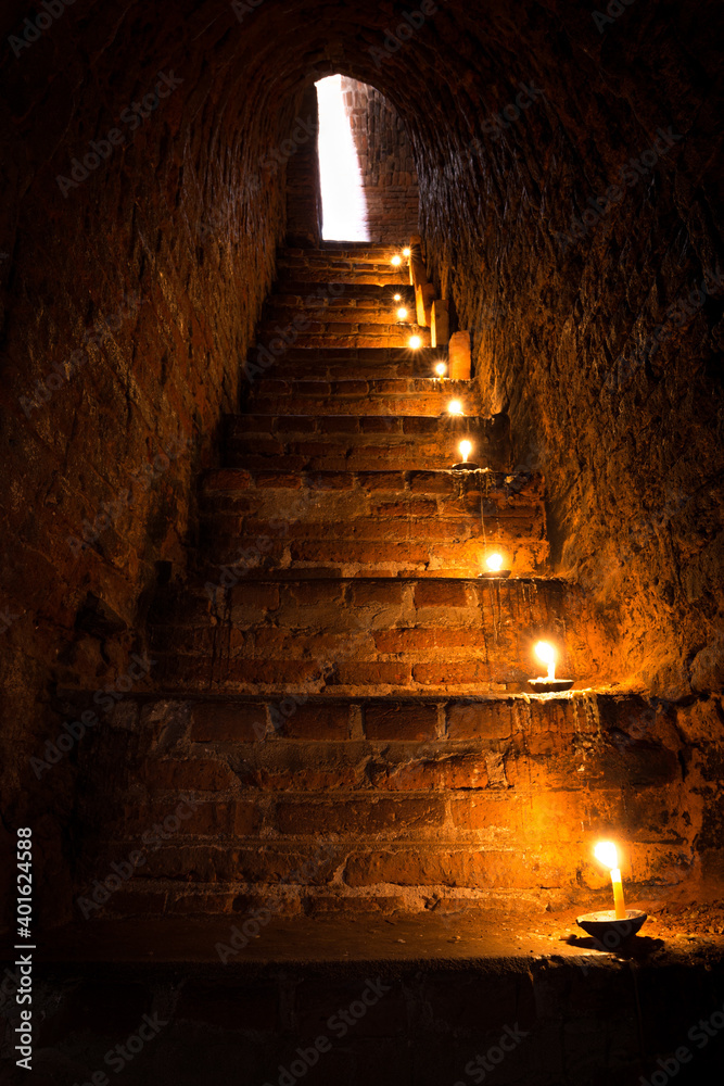 Candles on steps in a temple in Bagan, Myanmar Candles on steps in a temple in Bagan, Myanmar