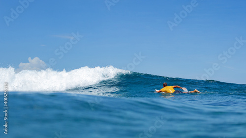 surfer on a blue wave. high quality photos