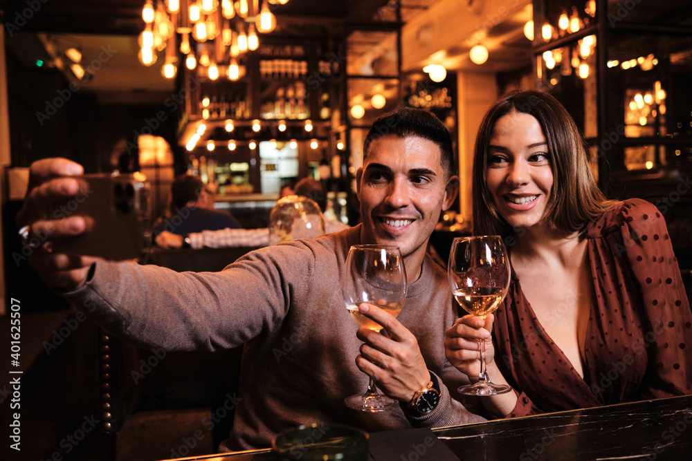 Couple taking a selfie with mobile phone.