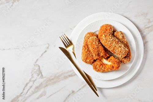 Italian suppli al telefono on a plate, copy space photo