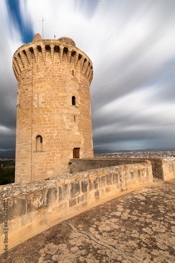 Tower of Bellver castle with clouds in motion in the sky in Mallorca, Spain