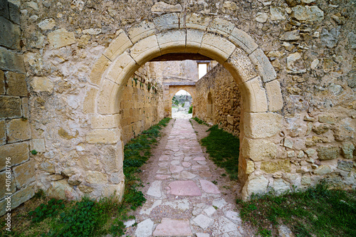 Old stone door and window of medieval architecture. Stone background. 