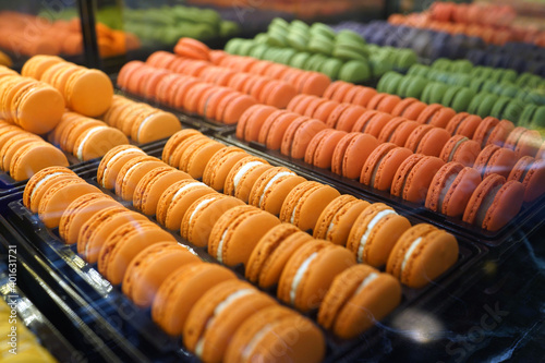 French sweet biscuit macaroons on cafe showcase. Variety of macaron flavours.