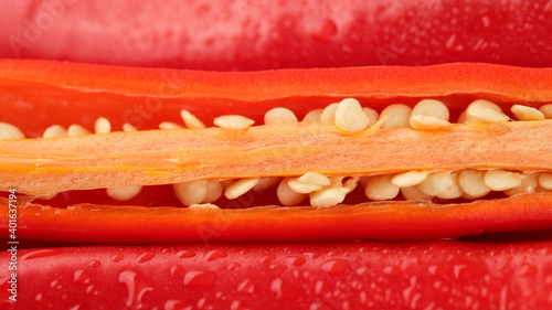 cut red hod chili pepper peppers with seeds inside close up photo