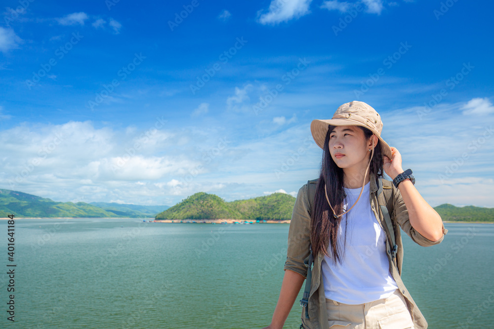 Asian Woman with Mae Moh Reservoir Background, Lampang Province.