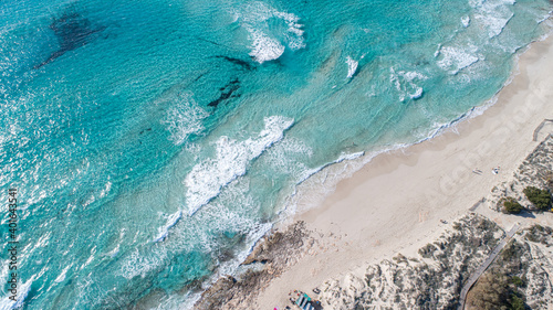 incredible beach with a turquoise sea in Formentera island seen from above