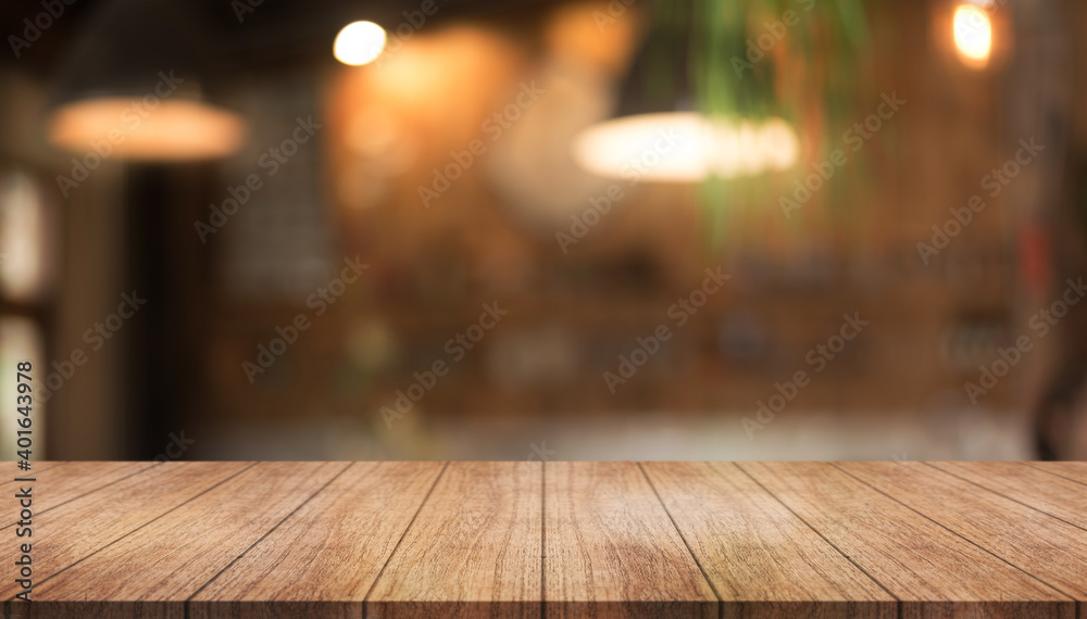 Empty wood table on blur restaurant background. Wooden top table background Empty wood table on blur restaurant background. Wooden top table background