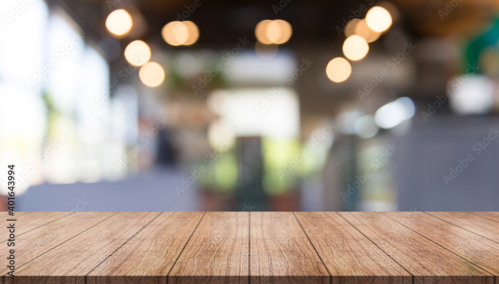 Empty wood table on blur restaurant background. Wooden top table background Empty wood table on blur restaurant background. Wooden top table background