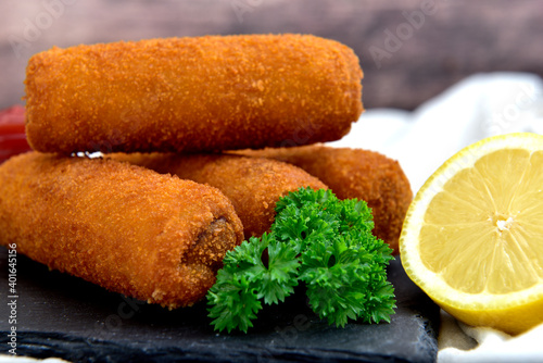Homemade Croquettes with lemon and stuffed with beef photo