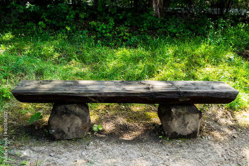 Obraz na płótnie Rustic bench in a garden