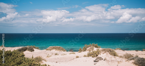 Breathtaking seascape with sandy beach and blue sky