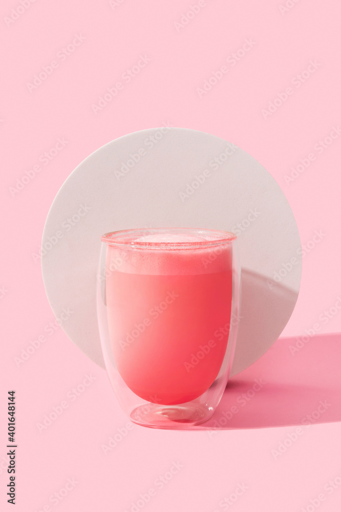 Pink rose milkshake in a transparent glass