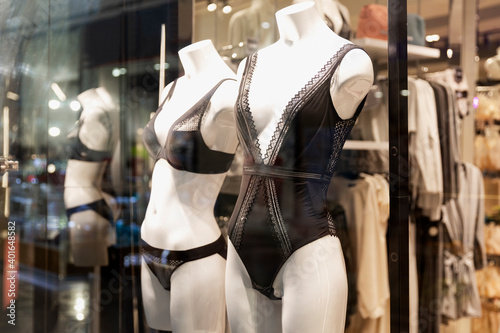 Mannequins in women's underwear in a shop window.