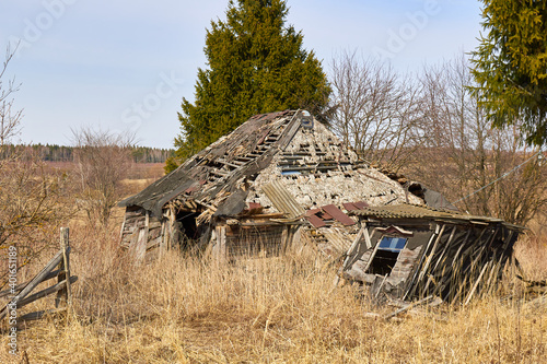 An old collapsed village house in a Russian village