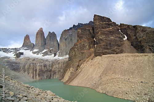View of Tres Torres, Cerro Nido de Condor and Lago Torres, Torres del Paine National Park. Patagonia. Chile. South America.