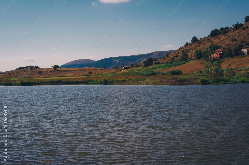 View of the hill, sky and lake.