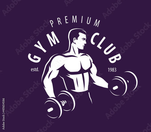 Gym club. Bodybuilder strong muscular man pumping up biceps muscles with dumbbells