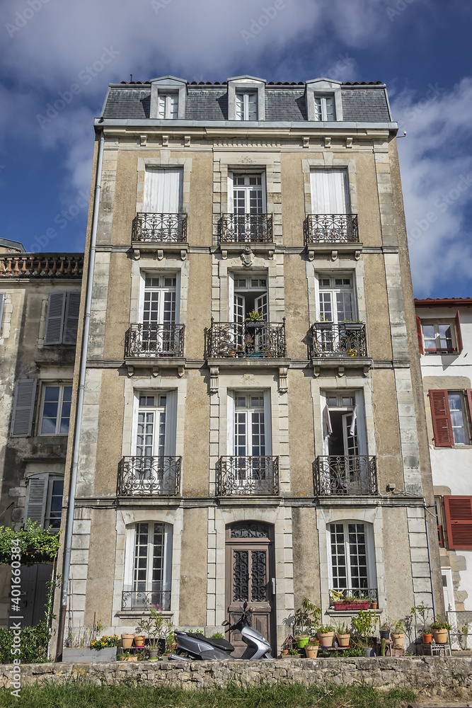 The architecture of traditional old buildings in Bayonne City Street. Bayonne, Department of Pyrenees-Atlantiques, Nouvelle-Aquitaine region, France.