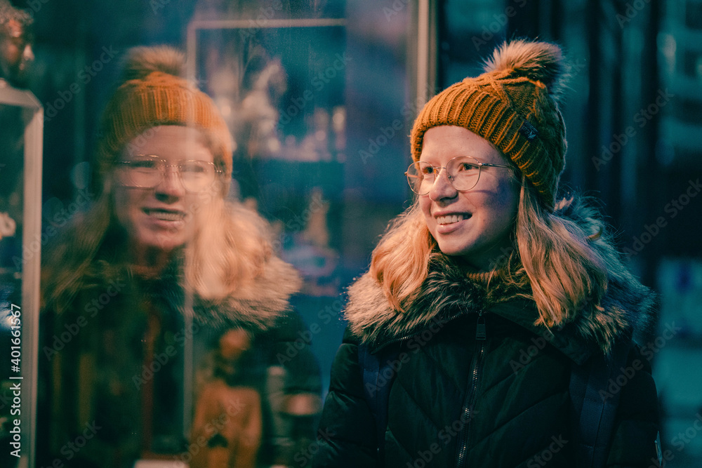 Woman looking in a store window Woman looking in a store window
