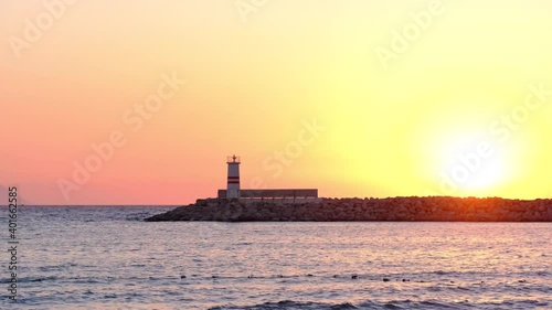Lighthouse on sunset in Kusadasi Town, Aydin, Turkey. Dramatical and romantic moment. Kusadasi Town is very famous and popular touristic place in Turkey.