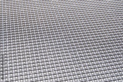 Surface of LED matrix outdoor large screen. Rows of LEDs on a modular panel. Selective focus with limited depth of field.