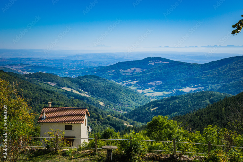 View from Lalouvesc in France on the mountains of Ardeche and even further, in the background you can see the Alps and the Mont Blanc.