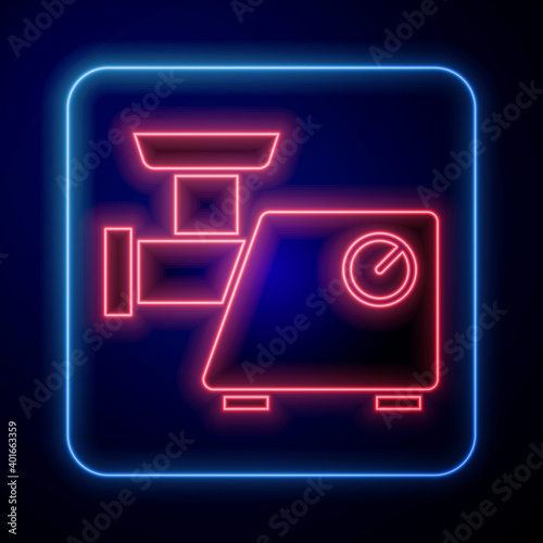 Glowing neon Kitchen meat grinder icon isolated on blue background. Vector.