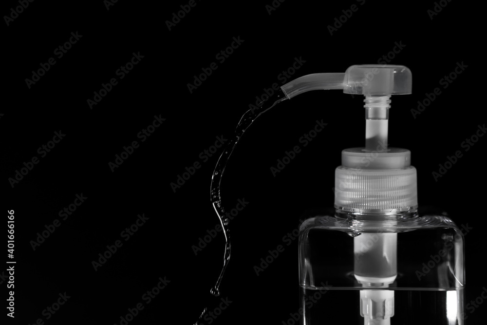 Sanitizing bottle with black background Sanitizing bottle with black background