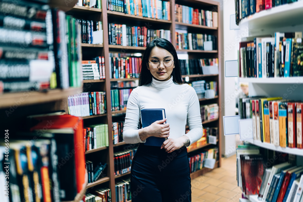 Asian female student studying in library Asian female student studying in library