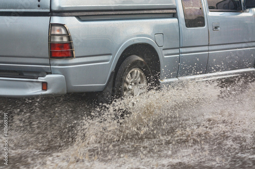 Car driving through flood in Thailand. 