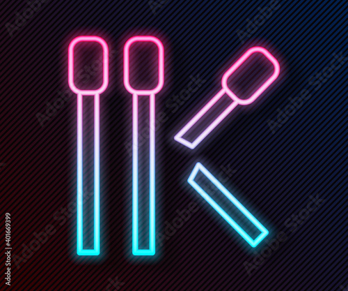 Glowing neon line Matches icon isolated on black background. Vector.
