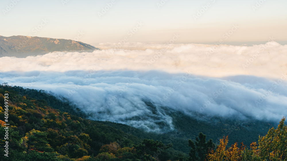 View above the clouds in the mountains of Crimea in the area of Ai-Petri - one of the highest mountains of Crimea and a tourist attraction. Stunning panorama of the natural view