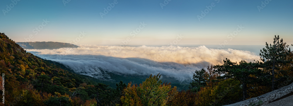 View above the clouds on the Big Yalta in the mountains of Crimea in the area of Ai-Petri - One of the highest mountains of the Crimea and a tourist attraction. Stunning panorama of the natural view