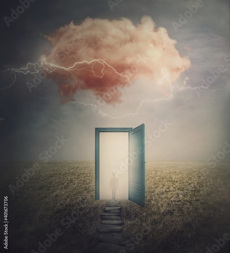Surreal scene, teleportation concept, time and space traveling through a open door on a mystic land. Magic cloud in the sky, mysterious lightnings and a wanderer person silhouette in the mist.