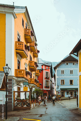 Fototapeta Naklejka Na Ścianę i Meble -  Hallstatt, Austria - June 15, 2019: view of tourist city street overloaded with people