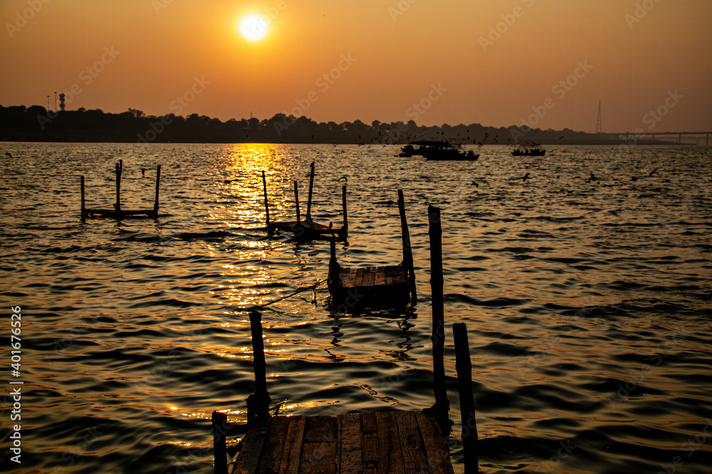 Beautiful sunset view at Triveni Sangam ( confluence of Rivers Ganga, Yamuna & Saraswati) at Prayagraj in India