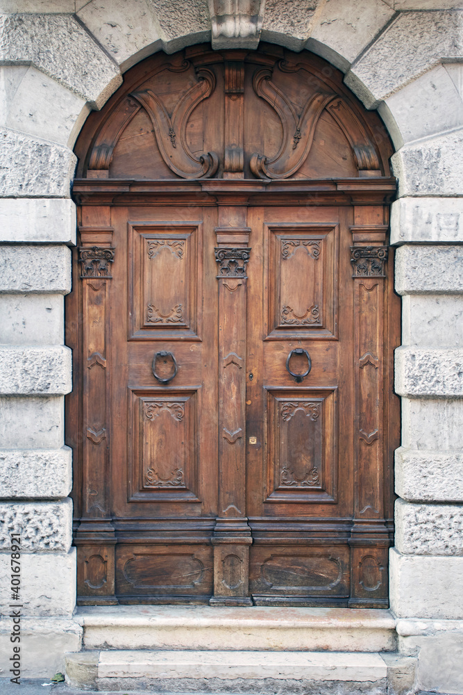 Italian retro wood style front door, element of the classic facade