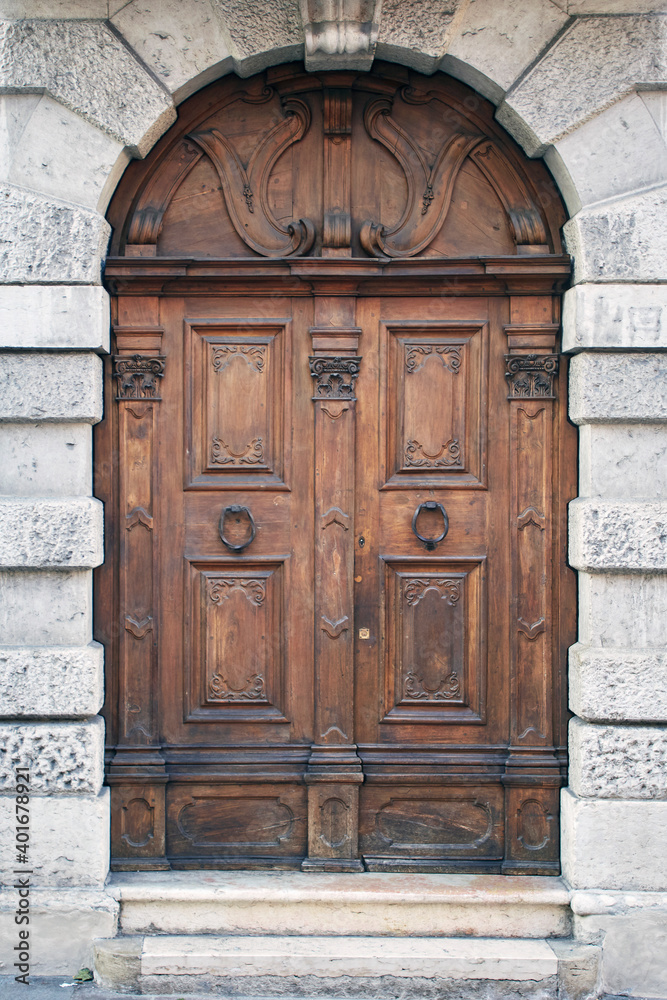 Italian retro wood style front door, element of the classic facade Italian retro wood style front door, element of the classic facade