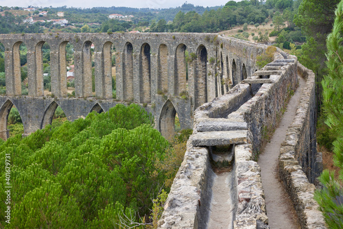 Impressive 17th century built Aqueduct for transporting of water from Pegoes springs to Convent of Christ, Tomar, Portugal. Surrounded by lush green forests. Influenced- Roman and Muslim architecture. photo
