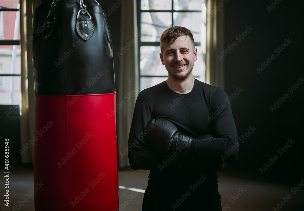 The man is an athlete boxing in the gym. Boxer practicing punches in the ring. Shadow-boxing. The athlete strikes with a punching bag. 4k video