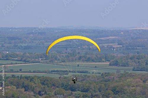 Paraglider flying at Combe Gibbet, England 