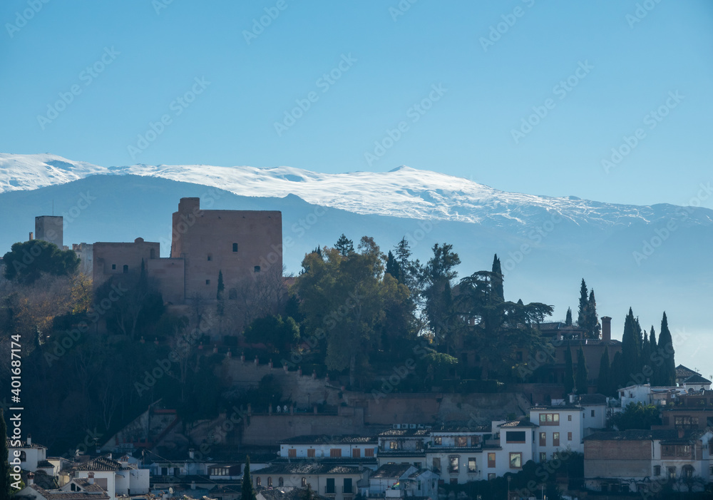 A walk in Granada: View of the profile of Torres Bermejas and the Alhambra forest from the Placeta Cristo de las Azucenas in the Albaicín