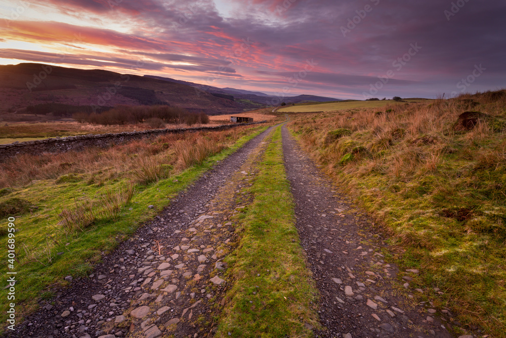 A farm road at dawn one the Gwrhyd mountain near Rhiwfawr and Cwmtwrch in South Wales UK
